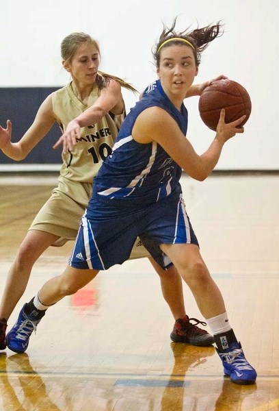 BALL CONTROL &#8211; Rachel McIntyre of the Paul Kane Blues protects the ball against Leah Beeler of the Fort McMurray Miners in Thursday&#8217;s opening game at the Paul