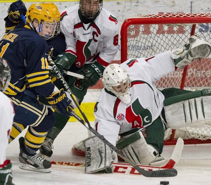 OFFENSIVE PRESSURE &#8211; Ryan Larochelle of the Southside Athletic Club guards the net against Matt McNeil of the St. Albert Raiders in Wednesday&#8217;s midget AAA game at 
