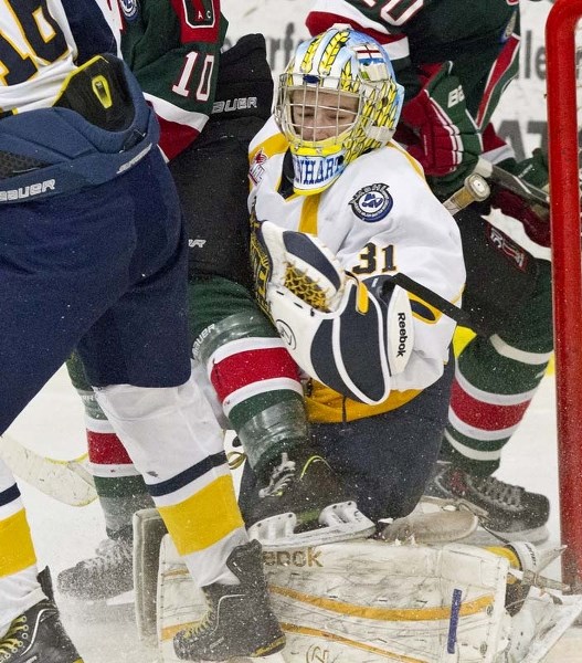 TRAFFIC JAM &#8211; Nate Reinhart of the St. Albert Gregg Distributors Sabres has company in the crease in Monday&#8217;s 6-5 loss to the SSAC Southgate Lions at Akinsdale