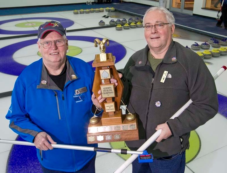 ROCK STARS &#8211; Milt McDougall (left) and Bob McKenzie of the St. Albert Curling Club proudly display the Alberta Sturling Championship trophy as winners of the 11th