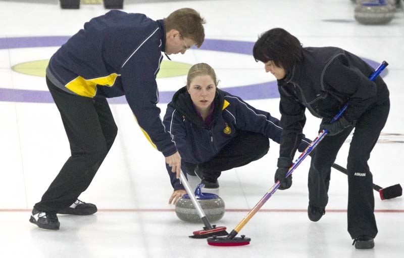ROCKING THE ICE &#8211; Colin Jenkyns and Alison Howes clear a path for Lauren Jenkyns&#8217; rock for the Doug McLennan rink in Sunday&#8217;s final at the Solo Liquor Mixed 
