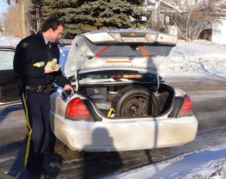 BLOCKED OFF – A member of ALERT packs up his gear after police conducted an investigation at an Erin Ridge home on Thursday