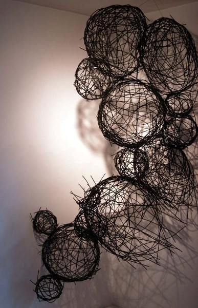AT HOME – The At Odds exhibit features a series of nests by artist Sydney Lancaster. The next symbolize identity