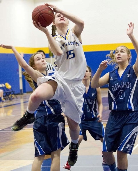 REACH FOR THE TOP &#8211; Marinya Marcichiw of the St. Albert Skyhawks goes airborne to get a shot away against the Paul Kane Blues in Tuesday&#8217;s metro Edmonton division 