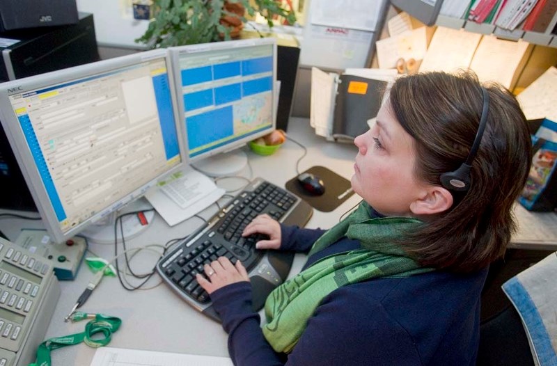 ON THE LINE – Emergency dispatcher Laura Fuoco is one of eight full-time people who answer 911 calls at the St. Albert RCMP detachment.