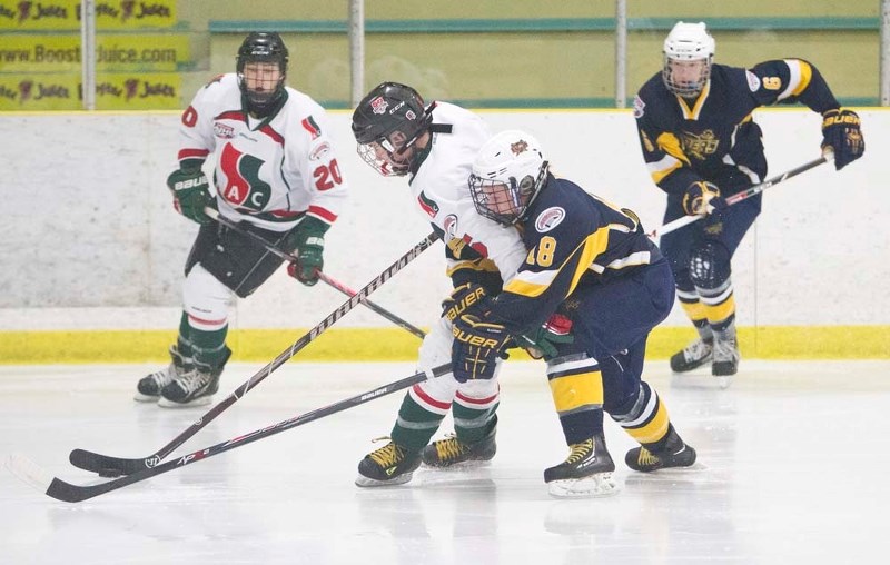 CLOSE COVERAGE &#8211; Dylan Huot of the St. Albert Flyers sticks to his check in Sunday&#8217;s 2-1 loss to the SSAC Bulldogs in the Alberta Minor Midget AAA Hockey League.