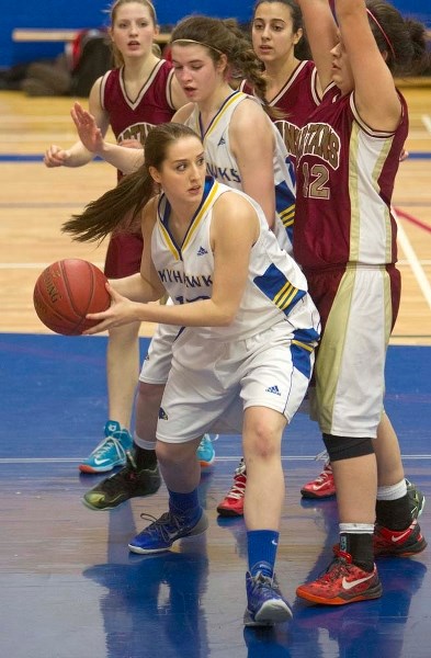 PASS PLAY &#8211; Jamie Cole of the St. Albert Skyhawks looks for support against the O&#8217;Leary Spartans in Wednesday&#8217;s metro Edmonton division one match at the