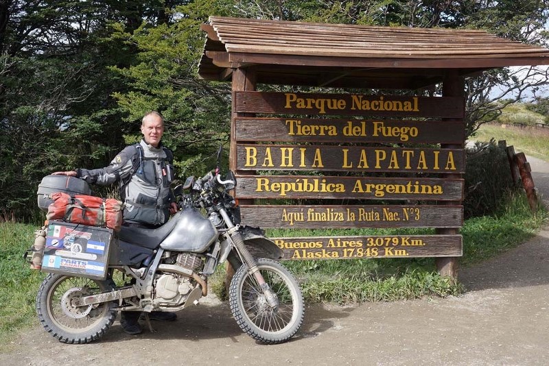 END OF THE ROAD – Motorcycle traveller Dave Ranson poses for a photo at the entrance of Tierra del Fuego National Park. The park is near the Argentinian city of Ushuaia and