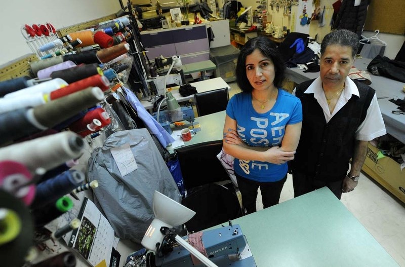 CLOSING TIME – Malaka and Nasir Qaderi inside their shop Kabul Tailoring in Grandin Mall. They have 60 days to close or move their business as the mall is closing.