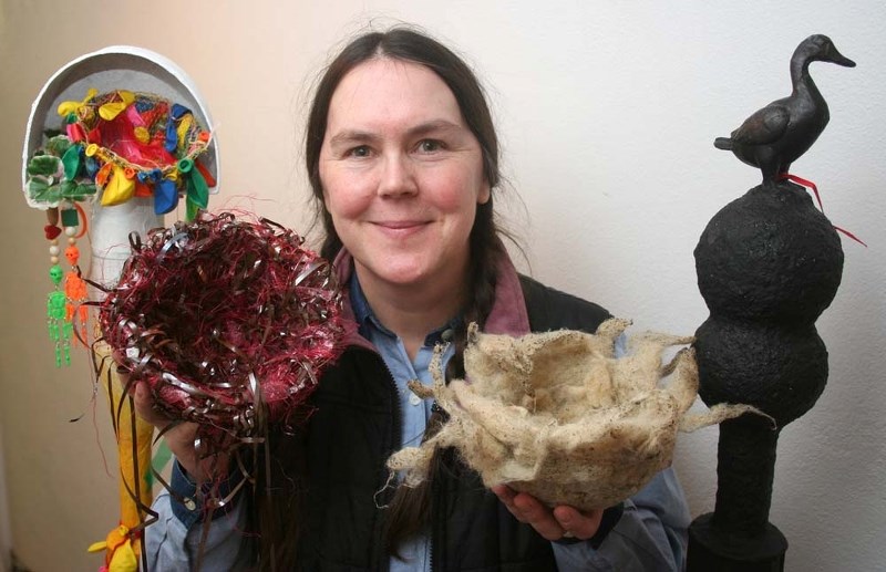 FRAGILE ELEMENTS – Artist Teresa Stieben shows off some of the birds nest creations that are part of the Fragile Elements exhibit.