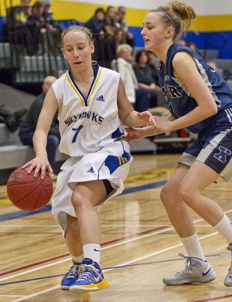 PUSHING FORWARD &#8211; Isabelle Durocher weaves her magic with the ball for the St. Albert Skyhawks in Monday&#8217;s 66-50 playoff win over the St. Francis Xavier Rams at