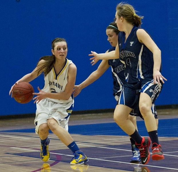 BALL HANDLER &#8211; Brielle Wise of the St. Albert Skyhawks controls the ball against Sydney Hurlburt (front) and Rachel McIntyre of the Paul Kane Blues in the metro