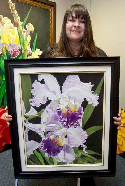 PRIZE PAINTING – Bernadette Neumann shows off the orchid painting that earned her a prize in the 2013 Torrit Grey Competition.