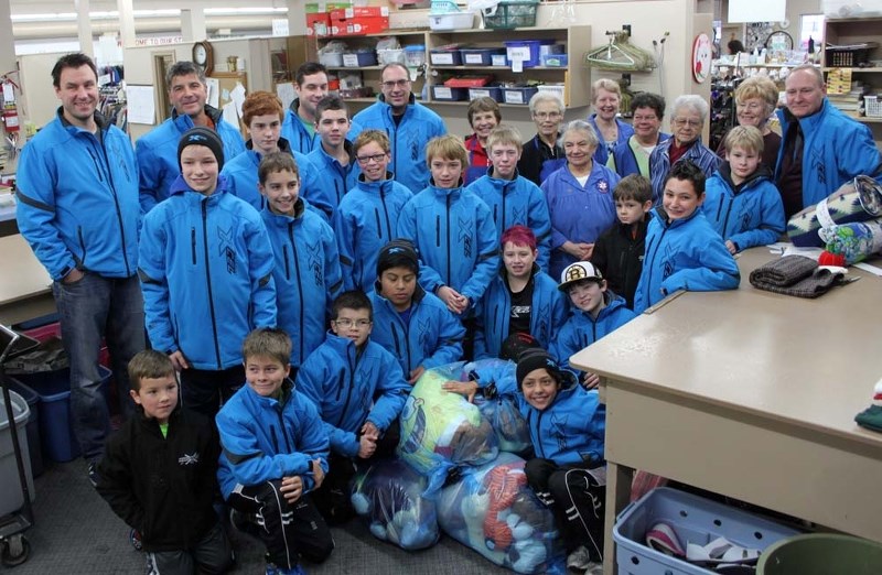 TOYS FOR HELP – The Peewee B2 St. Albert Xcel decided to make one of their tournament trips extra special by donating toys to a hospital auxiliary.