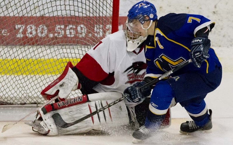 OFFENSIVE ASSAULT &#8211; Josh Jewell of the St. Albert Merchants attacks the net against Fort Saskatchewan Hawks&#8217; goalie Tyler Berger in game three in the best-of-five 
