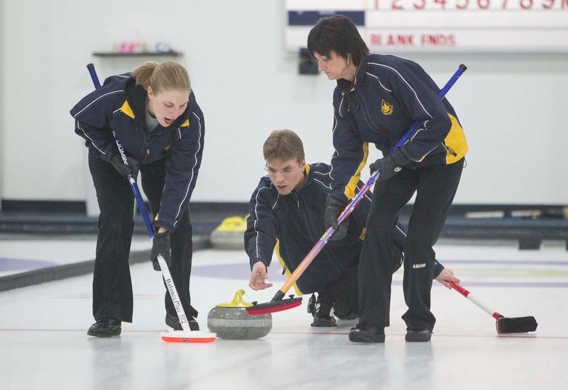 STONE THROWER &#8211; Colin Jenkyns releases the rock for Lauren Jenkyns and Alison Howes with the Doug McLennan rink in the President&#8217;s Cup A-B final Tuesday at the