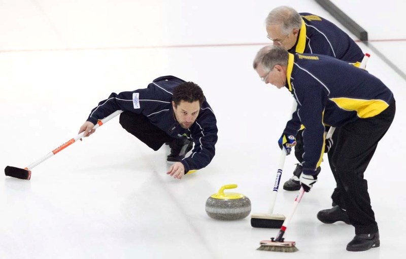 PULLING THE TRIGGER &#8211; Scott Pfeifer guns a rock for sweepers Ralph Killips (front) and Brian Pfeifer in the President&#8217;s Cup A-B final Wednesday at the St. Albert