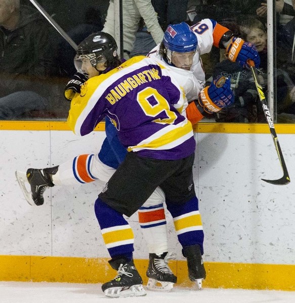 BOARDING &#8211; Aaron Baumgartner of the Morinville Kings pins Curtis Billsten of the Okotoks Drillers against the boards in Friday&#8217;s quarter-finals at the Hockey