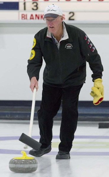 STICK SHOOTER &#8211; John Campbell delivers a rock in the 10th annual Canadian Open Stick Curling Championship final Wednesday at the St. Albert Curling Club. In the sixth