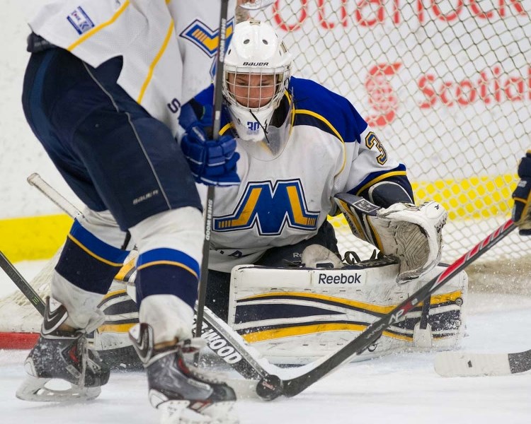 NET PROTECTOR &#8211; Max Cathcart guards the net for the St. Albert Merchants against the North Peace Navigators in Sunday&#8217;s bronze-medal final at the junior B