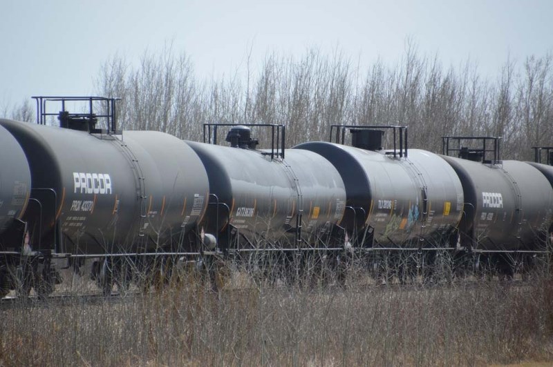 LONG HAUL – A CN Rail train loaded with cars snakes its way slowly on the tracks adjacent to Campbell Business Park on Tuesday.