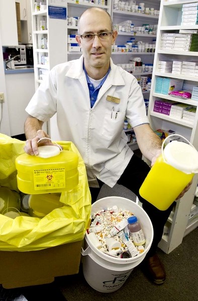 SPRING CLEANING – Pharmacist Ryan Diprose says spring is a good time to dispose of unneeded or expired medication. Area pharmacies collect such materials for proper disposal.