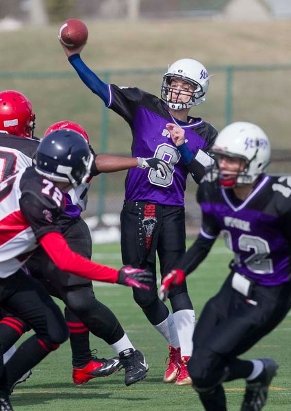 DELIVERING THE BALL &#8211; Trace Stuht of the St. Albert Storm looks to pass as receiver Wyatt Bates heads down field against the West Edmonton Raiders in Saturday&#8217;s