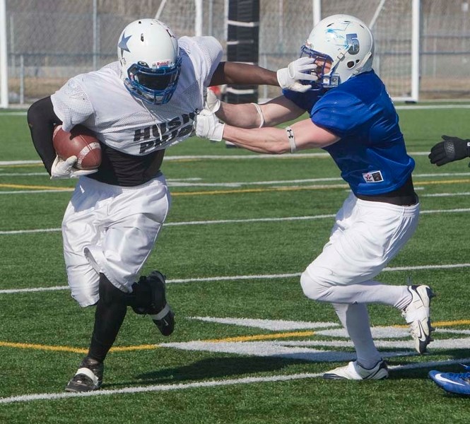 GRIDIRON STARS &#8211; Devin Guedo tracks down ball carrier Emmanuel Gordon during the St. Albert Stars&#8217; scrimmage Sunday afternoon at Riel Recreation Park. The Alberta 