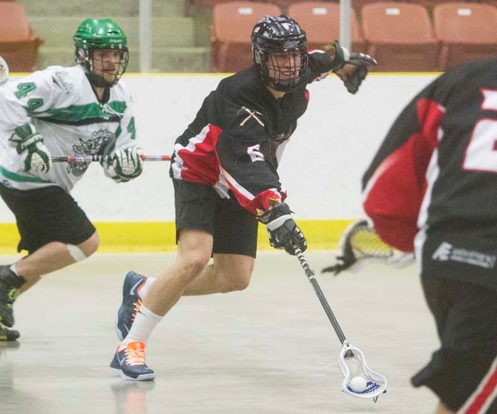 FORWARD DRIVEN &#8211; John Lintz of the St. Albert Miners controls the ball while breaking away from Trevor Howse of the Okotoks Raiders in Sunday&#8217;s senior B match in