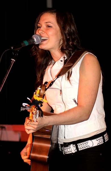 TOP OF CHARTS – Julia Nicholson delivers a song at the Global Country Star Search event