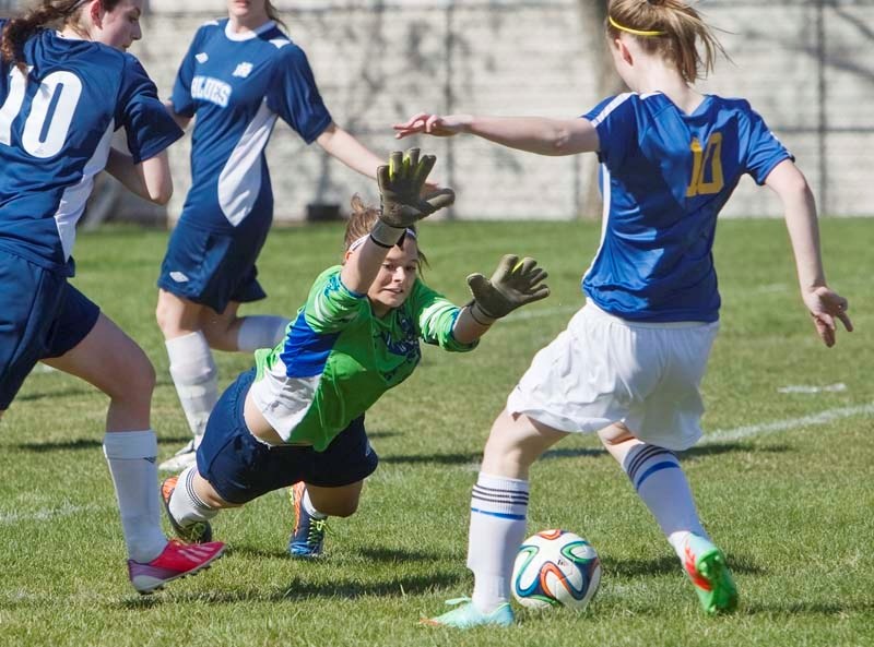 SHOT STOPPER &#8211; Gillian Ainslie-O&#8217;Connor of the Paul Kane Blues dives to block a close-range strike from Amy Gunn of the St. Albert Skyhawks in Tuesday&#8217;s
