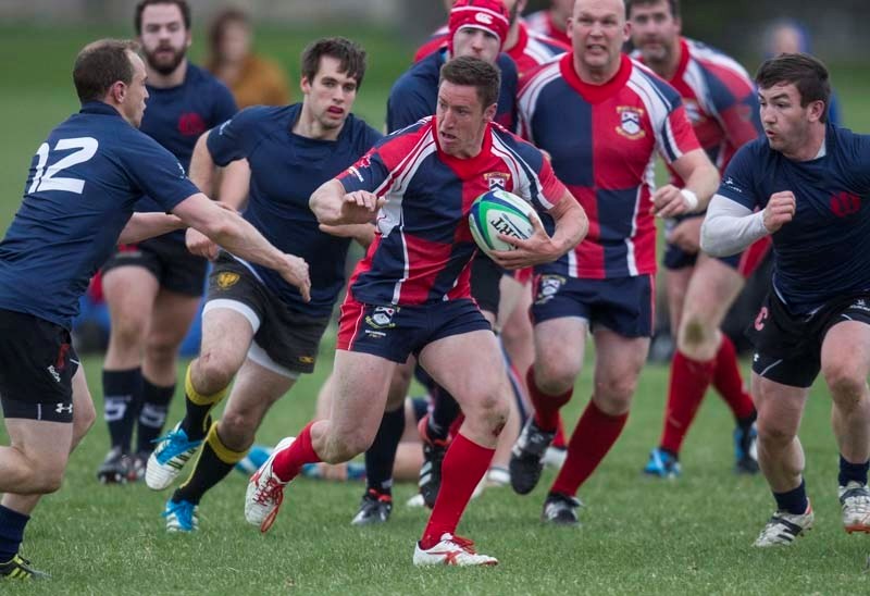 SURROUNDED &#8211; Jake Robinson of St. Albert attracts a crowd in Thursday&#8217;s Alberta Cup match against the Clansmen at Airway Park. The premier men&#8217;s team racked 