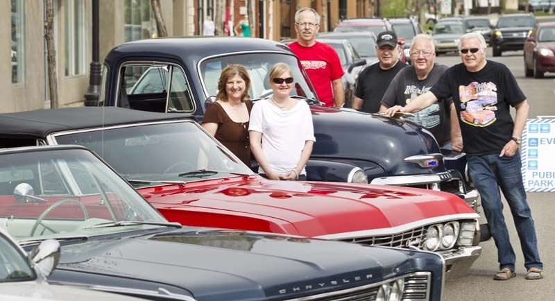 MUSCLE CARS – Autorama is being held on Perron Street this Sunday instead of at St. Albert Centre as in past years. Organizers: back row left to right