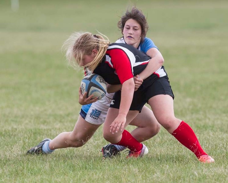 HARD HIT – PK Blues women&#8217;s rugby scrum half Annie Boyd brings down her opponent as her team battled Jasper Place in division two playoff action in Edmonton at Pirates