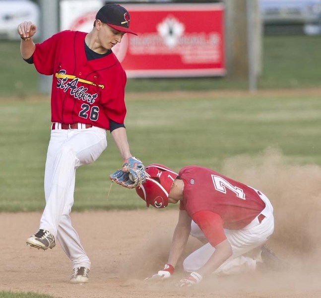 PLAYING THE FIELD &#8211; Riley Fisher of the midget AA St. Albert Cardinals covers second base against the Community Park Reds at the recent Early Bird tournament at Legion