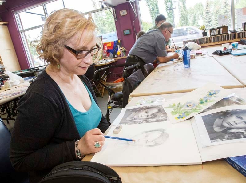 AABIS SHOW – Edmonton artist and treasurer of the Alberta Artists with Brain Injury Society (AABIS) Michele Gee works on a pencil sketch at the Nina Haggerty Centre for the