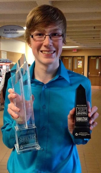 AWARD-WINNING FILMMAKER – Student filmmaker Bryce Grimes of Lillian Osborne High School shows off his awards for best film and best use of sound