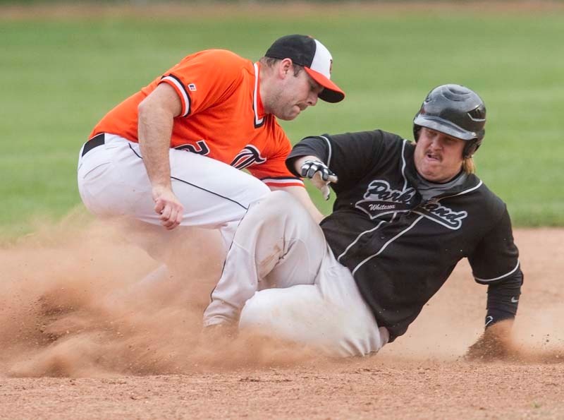 KICKING UP DIRT &#8211; Nathan Wedgewood of the Parkland White Sox slides into second base against John McHugh of the St. Albert Tigers in Wednesday&#8217;s Sunburst Baseball 