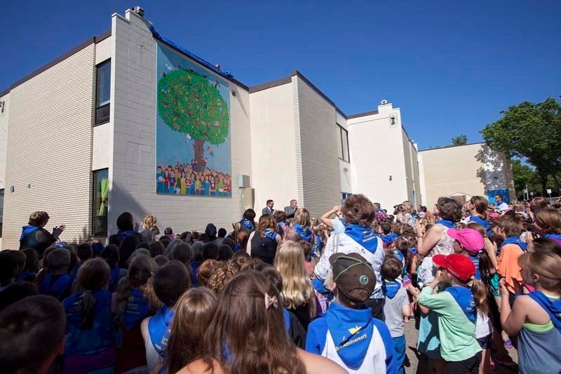 IT&#8217;S A PARTY –Students gather outside Leo Nickerson Elementary School Tuesday to watch the unveiling of the school&#8217;s new 50th anniversary mural.