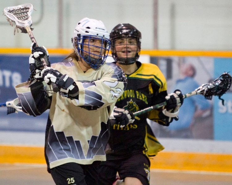 FLY BY – St. Albert Drillers Charleigh Kandas fires a shot against the Sherwood Park Titans during a game at the South Side Arena in Edmonton