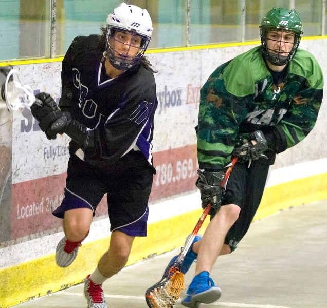 St. Albert Crude&#8217;s Reece Runco carries the ball forward during a game against the Saskatoon SWAT at Akinsdale Arena