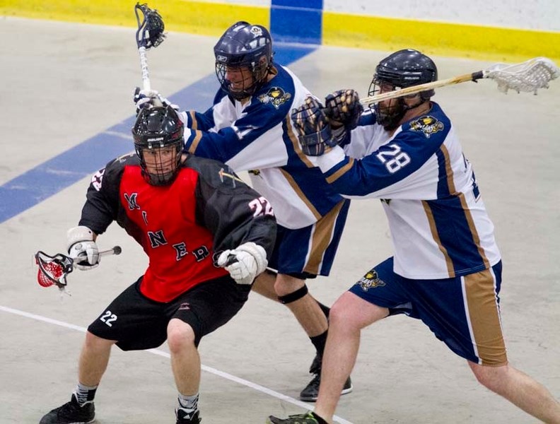 BLAST – St. Albert Miners&#8217; runner Matt Hamson moves the ball past two Edmonton Outlaws during a match at Servus Place