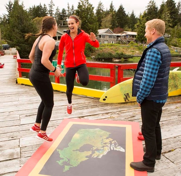 FIRST AGAIN – Meaghan Mikkelson (centre) and Natalie Spooner celebrate their second consecutive first-place finish on the reality show Amazing Race Canada