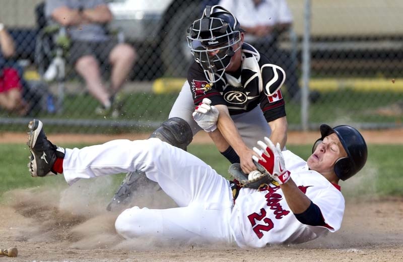 CAUGHT STEALING &#8211; Matty Quartel of the St. Albert Cardinals is tagged out by catcher Darian Poole while trying to stretch a triple into an inside the park home run in