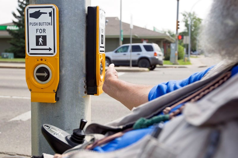 NOT ERGONOMICAL – Many crosswalk intersection buttons are awkwardly placed