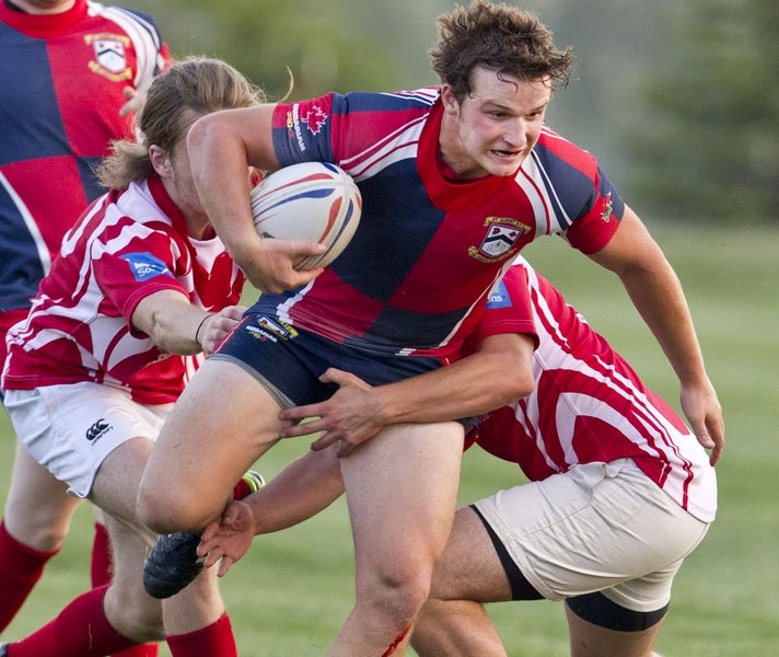 GAINING GROUND &#8211; St. Albert junior Chad Monai-Brophy pushes forward against the Strathcona Druids in the Edmonton Rugby Union U19 semifinal Wednesday at the St. Albert