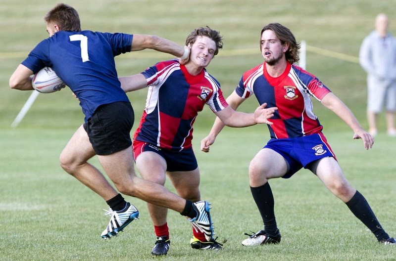 STRIKER &#8211; St. Albert junior Chad Monai-Brophy is on the receiving end of a stiff-arm in Wednesday&#8217;s 27-7 loss to the Clansmen in the Edmonton Rugby Union&#8217;s