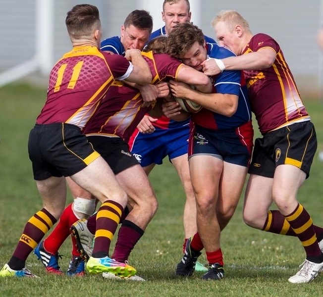 COLLARED &#8211; Chad Monai-Brophy maintains possession while the Nor&#8217;Westers tighten their grip on the St. Albert player in Saturday&#8217;s premier men&#8217;s match. 