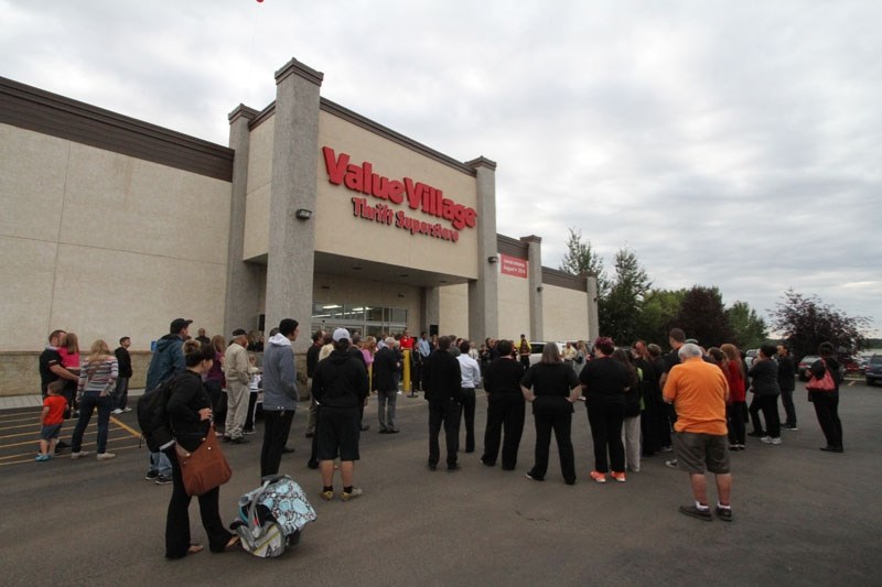 OPEN THE DOORS – Value Village swung open its doors to more than 300 bargain hunters who were patiently waiting outside for the store to open Thursday morning. The store has