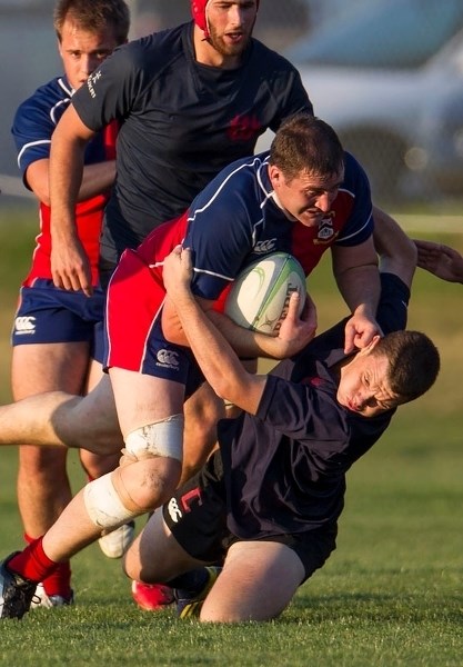 BULLDOZER – Johnny Moloney refuses to go down without a fight while plowing into contact as the St. Albert premier men&#8217;s team punished the Clansmen 67-0 Thursday at the 